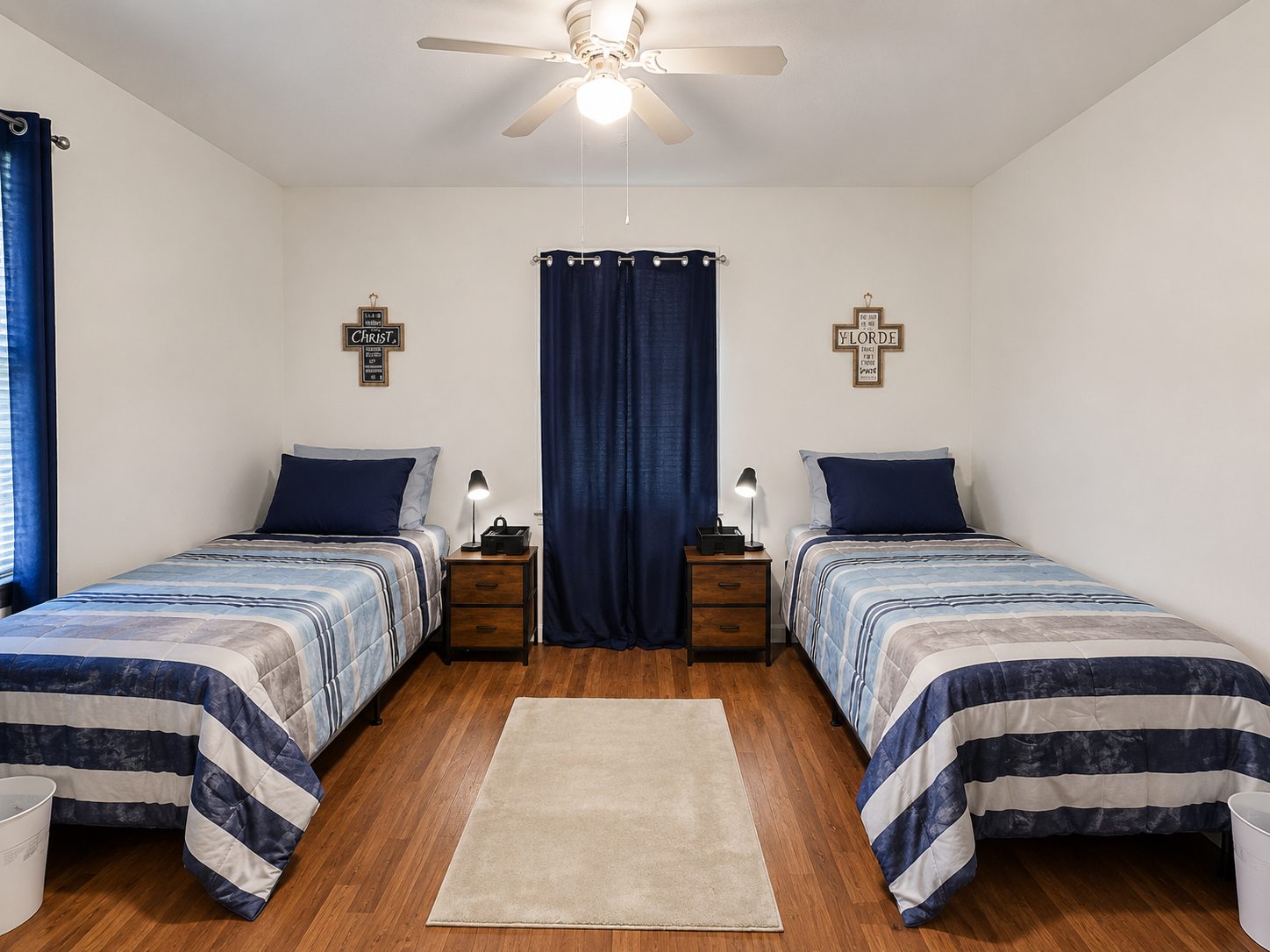 Shared bedroom showing two beds, a dresser, and space to move comfortably